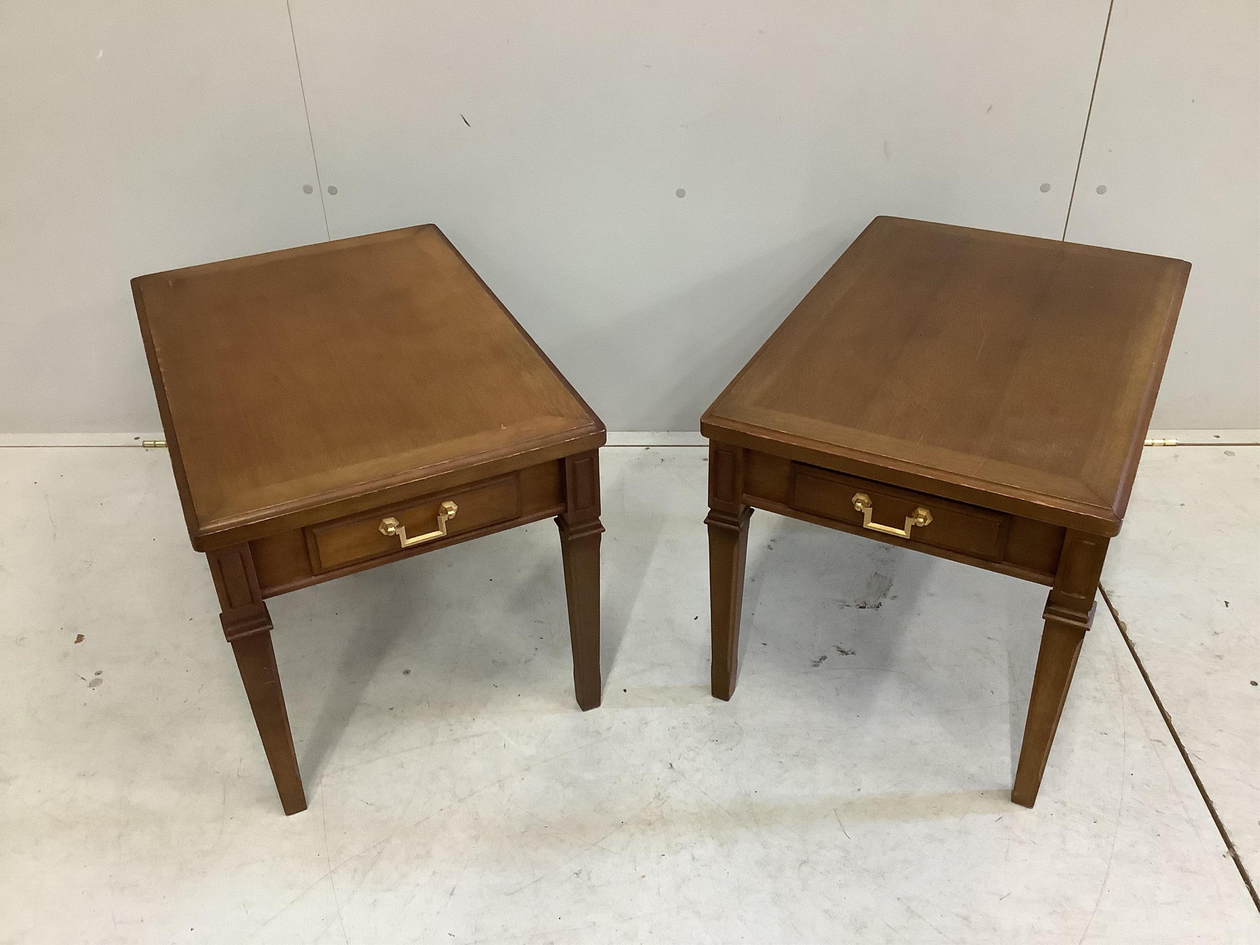 A pair of Maruni Furniture mahogany lamp tables, width 45cm, depth 68cm, height 45cm. Condition - fair